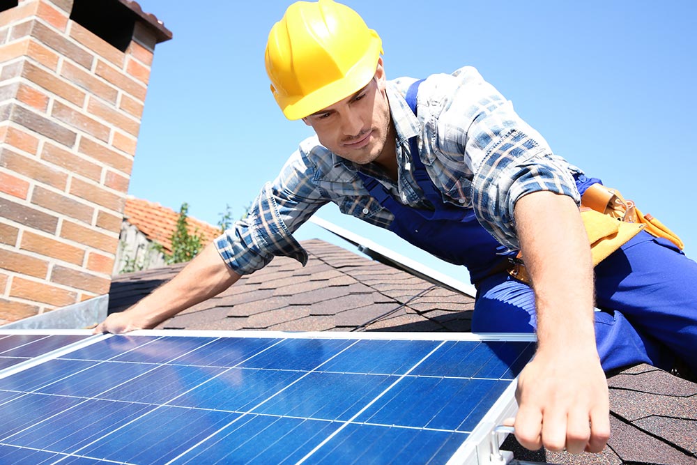Solar Panels Installation Solar Panels being fitted by contractor to house roof.